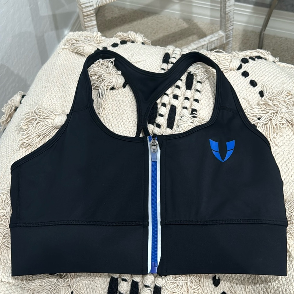 Black and blue firmabs zipup sports bra. USA size M, China size L.